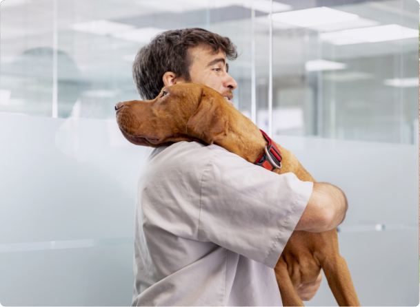 man holding dog